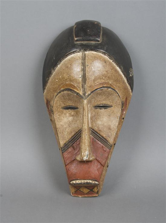 A Carved and Polychrome Decorated