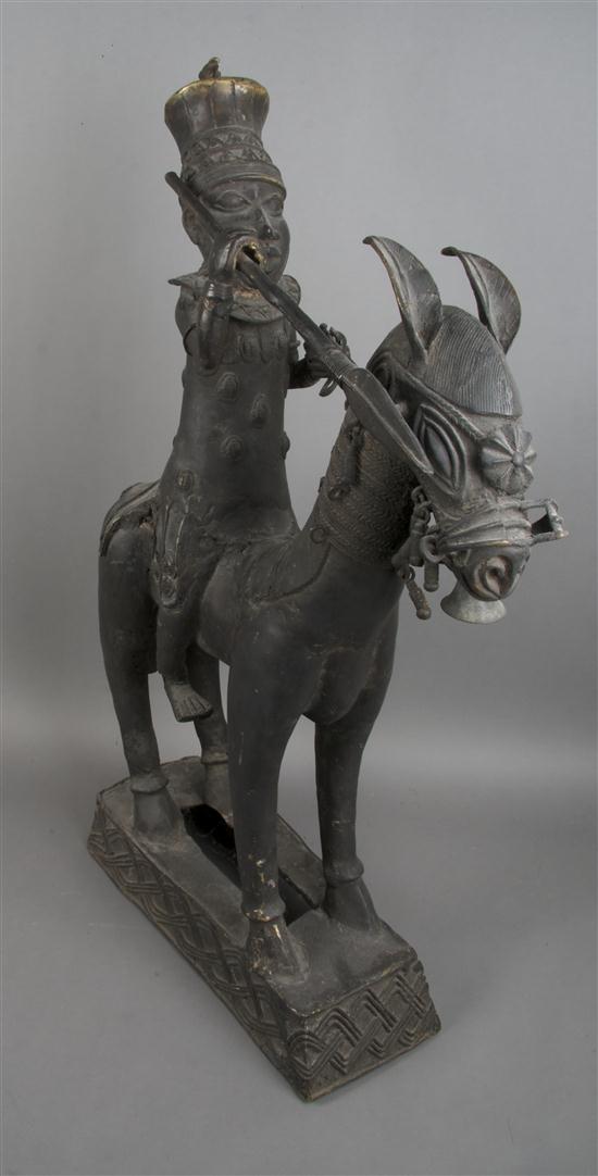 A Cast Bronze Equestrian Figure
