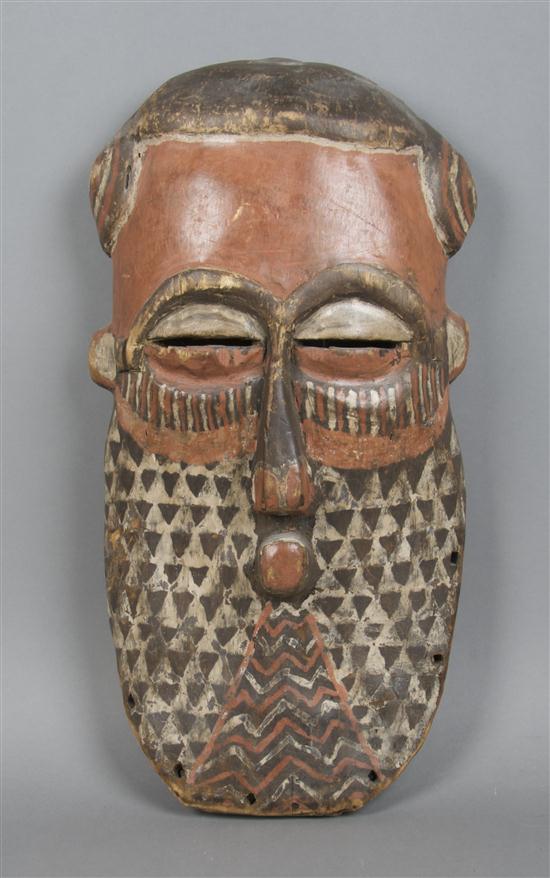 A Carved and Polychrome Decorated Mask
