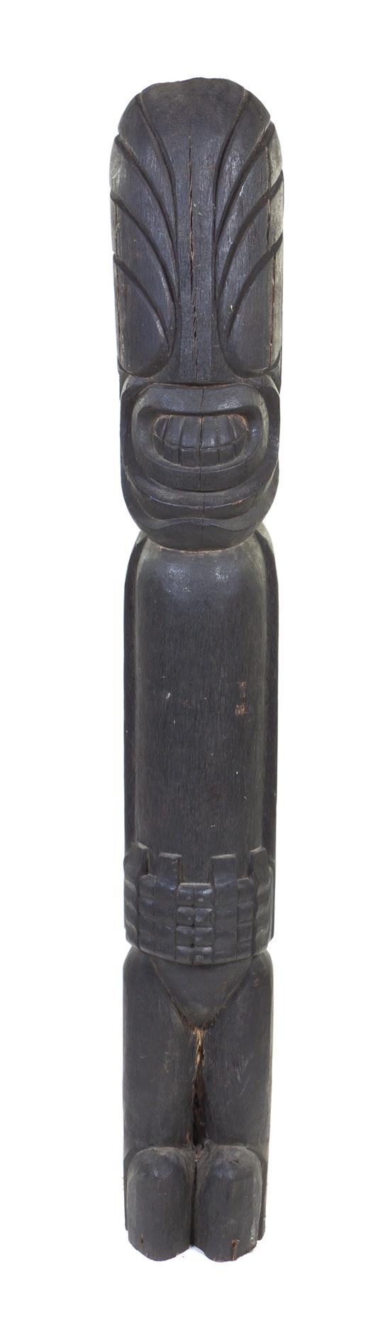 A Carved Wood Tiki Totem depicting 1554b9