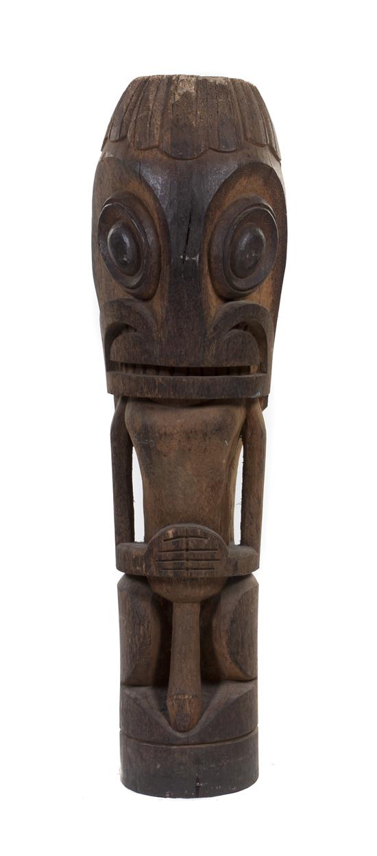 A Carved Wood Tiki depicting a 1554ba