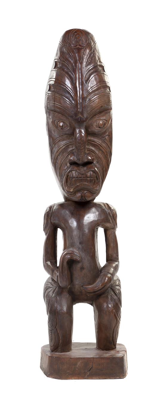 A Carved Wood Tiki depicted in