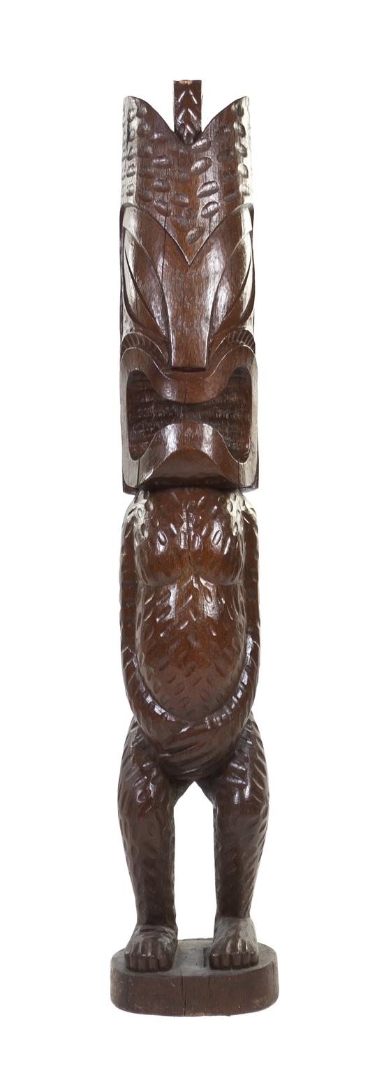 A Carved Wood Tiki depicted upright