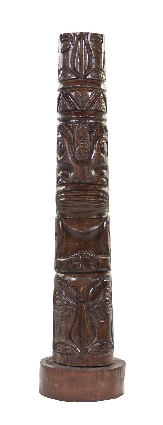 A Carved Wood Tiki Totem of tapering