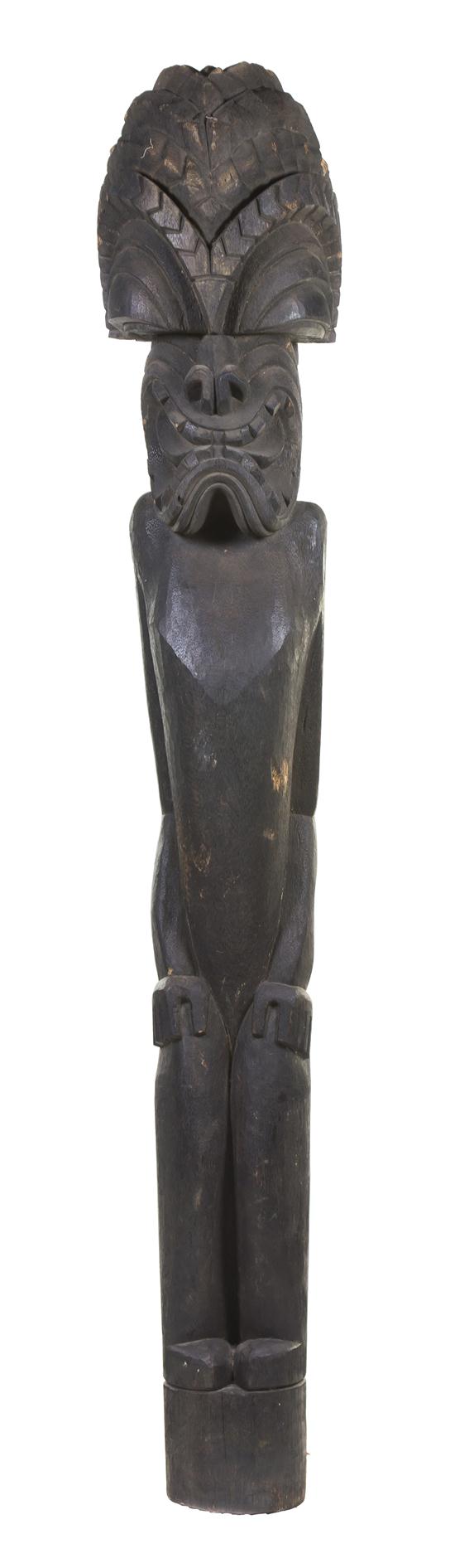 A Carved Wood Tiki depicting a 1554ce