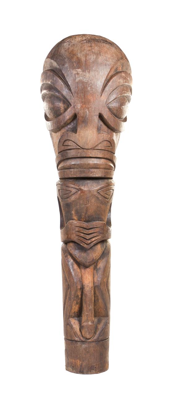 A Carved Wood Tiki depicting a 1554ca