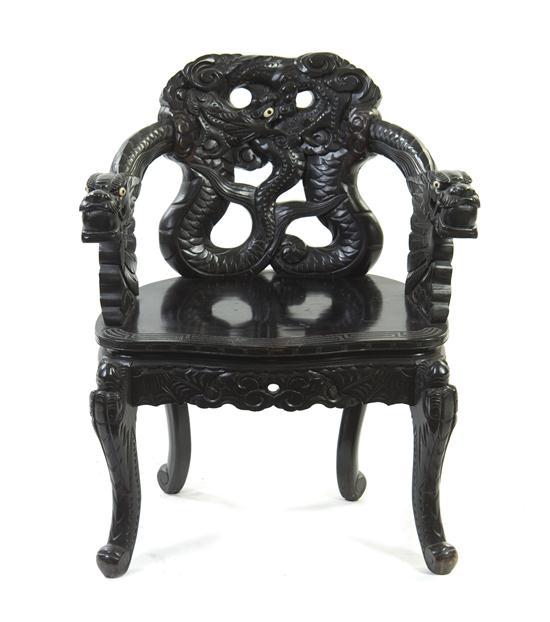 A Chinese Carved Armchair heavily