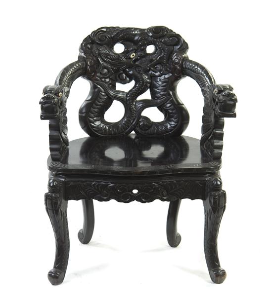 A Chinese Carved Armchair heavily carved