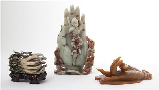 A Carved and Stained Ivory Buddha's