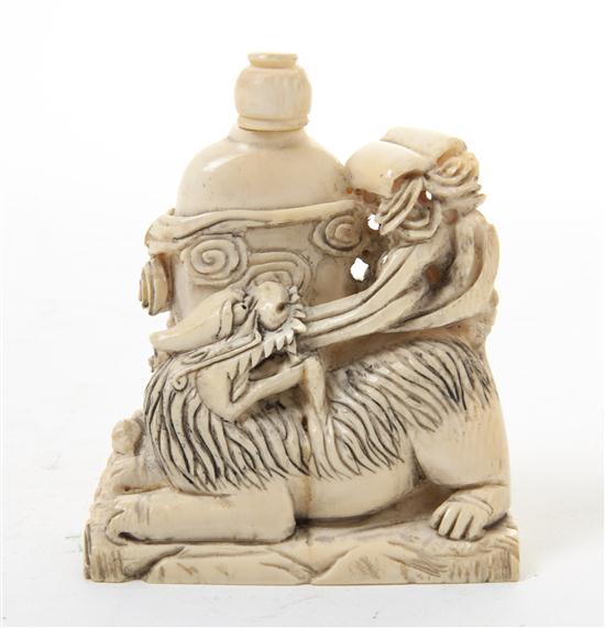 * A Carved Ivory Snuff Bottle with a