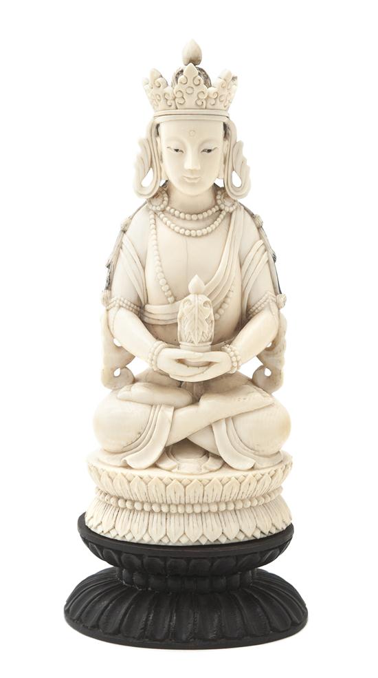 A Carved Ivory Figure of a Seated Buddha