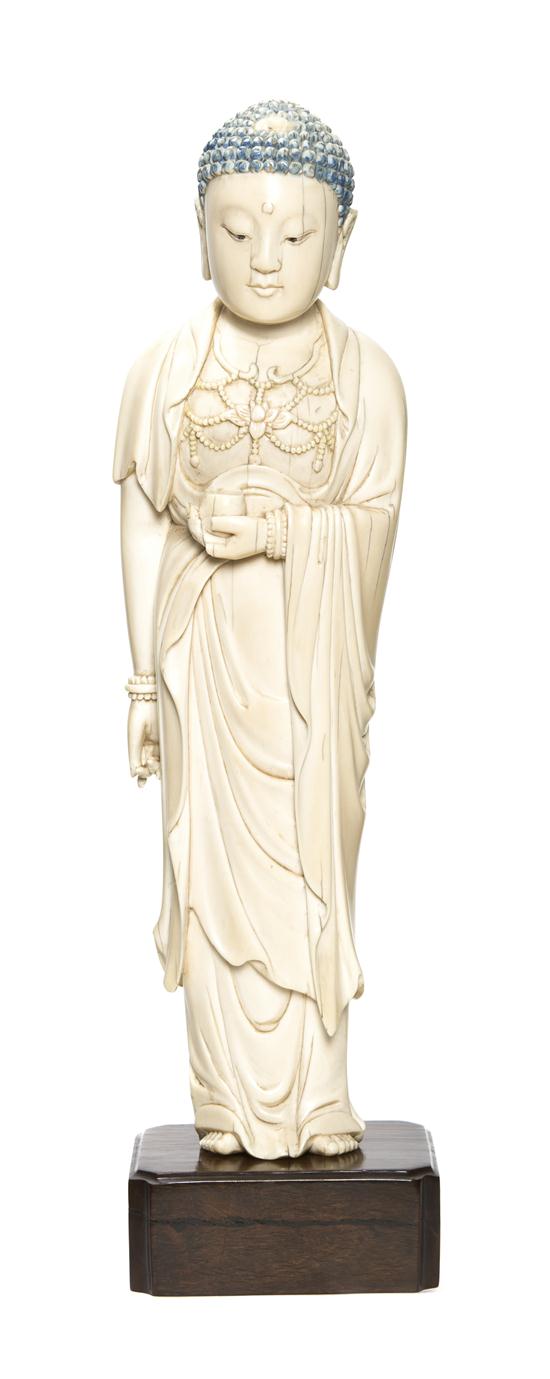 A Standing Ivory Figure of Buddha depicted