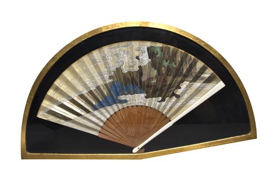 A Chinese Fan depicting a seated