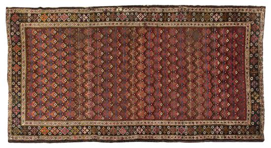 A Kurdish Wool Rug having repeating 1556de