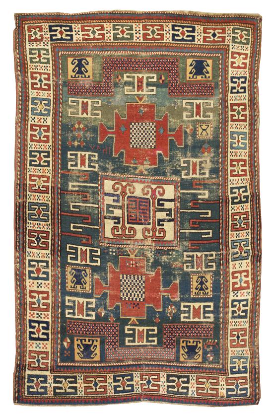  A Kazak Wool Rug having three 1556e2