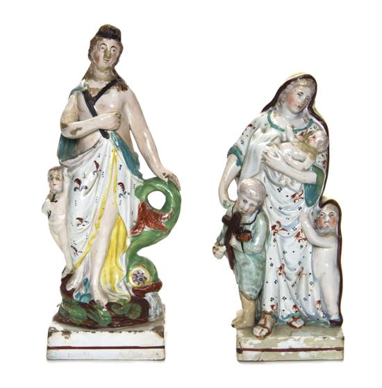 Two Staffordshire Figures each