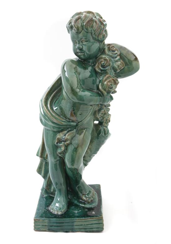 A Glazed Ceramic Figure depicting a