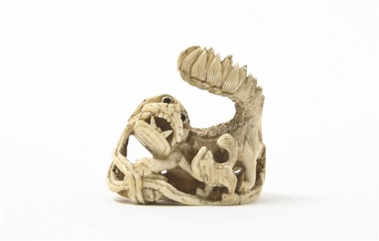 An Ivory Toggle of a Fu Dog with 15589d