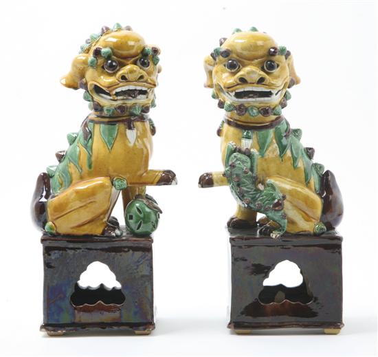 A Pair of Ceramic Sancai Glazed Fu Dogs