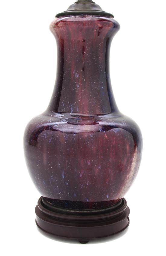 A Glazed Sang de Boeuf Flambe Vase
