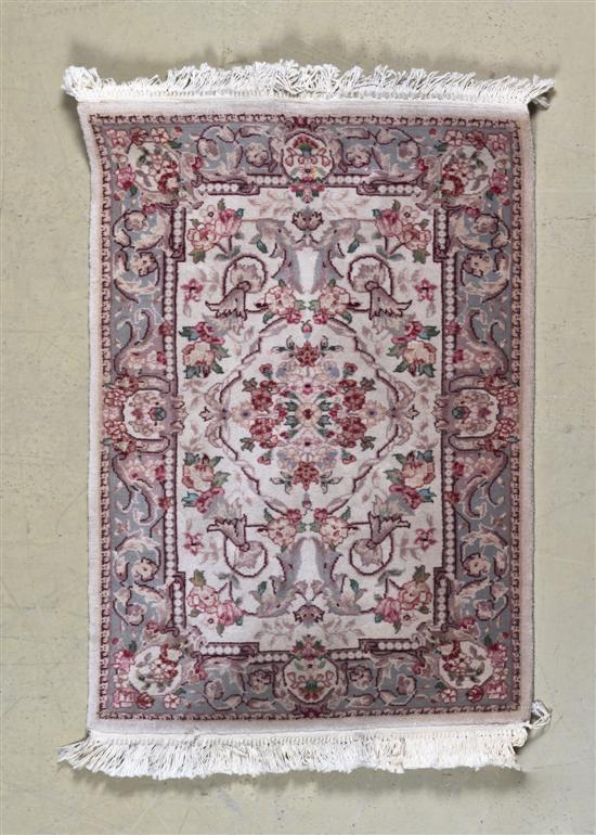 A Persian Wool Rug decorated with 1559a4