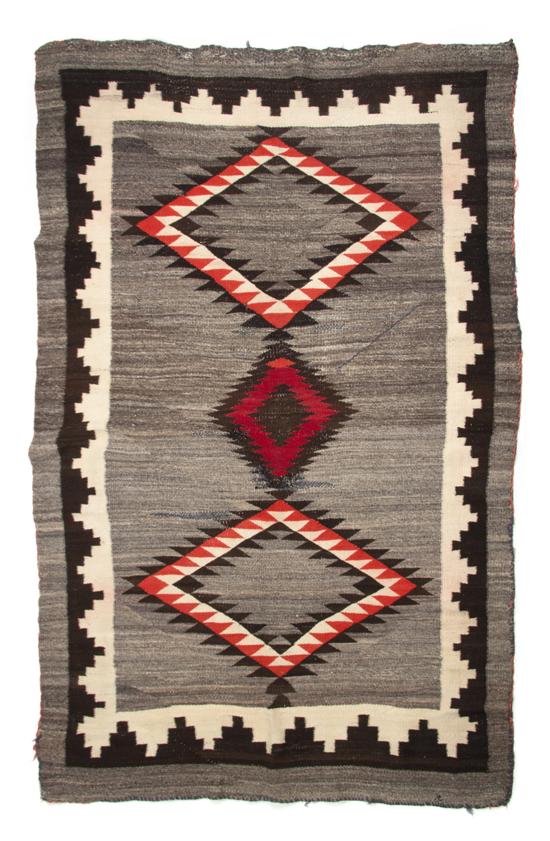 A Navajo Blanket having three diamonds