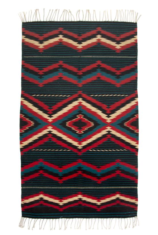 A Navajo Blanket having diamond decoration