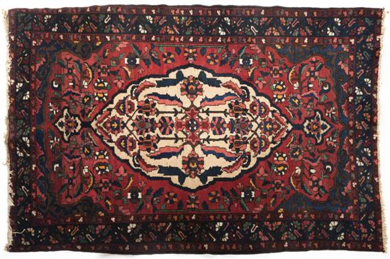  A Heriz Wool Rug having a stylized 1559ac