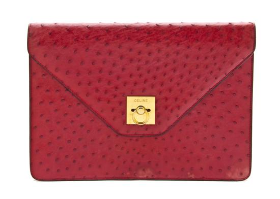 A Celine Red Ostrich Clutch goldtone 155b5b