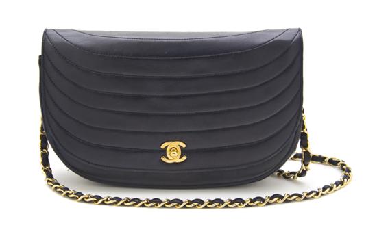 A Chanel Navy Leather Bag in a