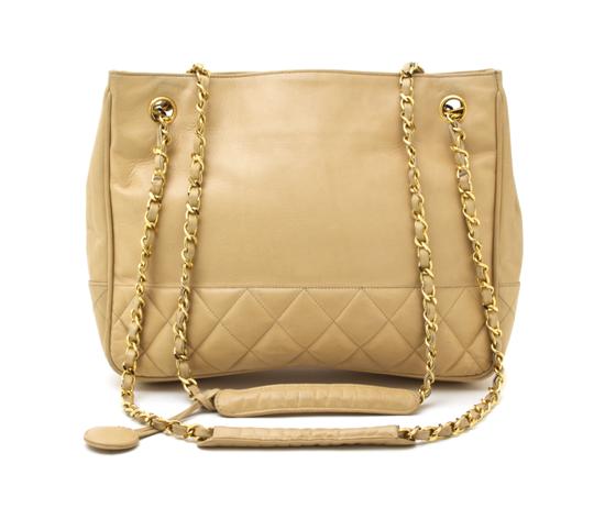 A Chanel Tan Leather Bag partially