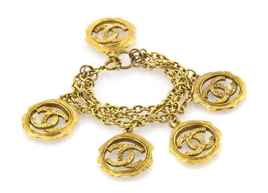 A Chanel Triple Strand Goldtone