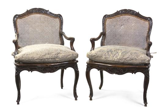 *A Pair of Regence Walnut Fauteuils