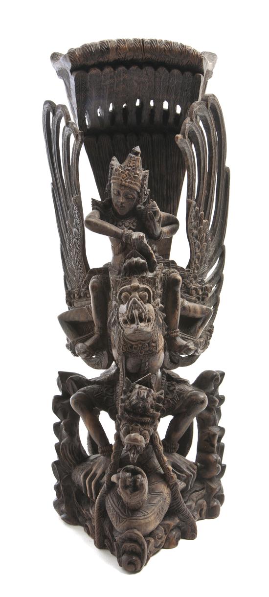 *A Balinese Carved Wood Figure of a