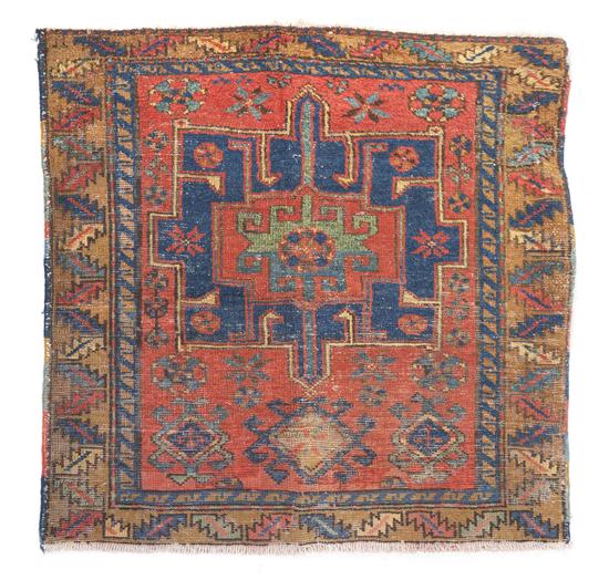 A Heriz Wool Rug having a geometric