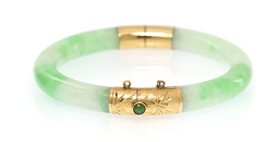 A Chinese Jade Bangle with 14 Karat