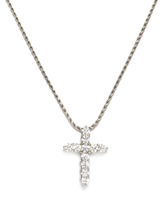 A 14 Karat White Gold and Diamond Cross