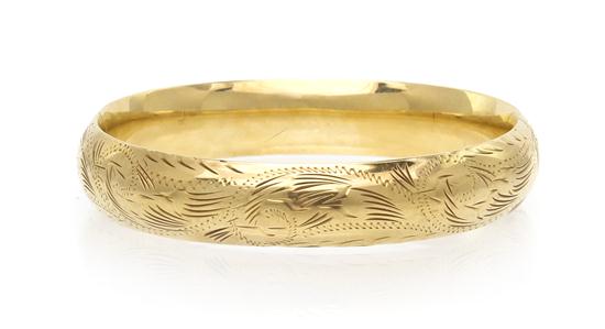 A 14 Karat Yellow Gold Hinged Bangle