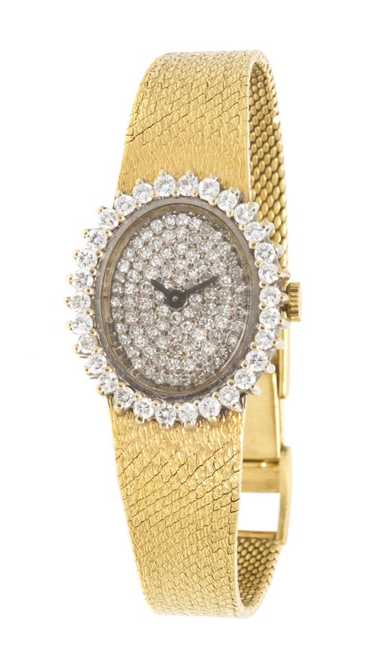 An 18 Karat Gold and Diamond Watch