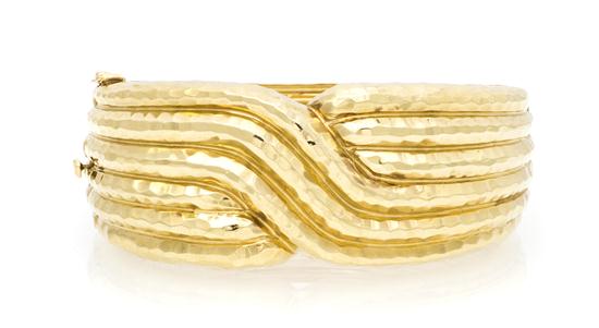 A 14 Karat Yellow Gold Hammered Textured