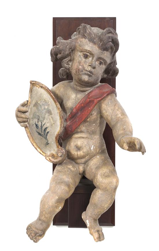 A Continental Polychrome Plaster Putti