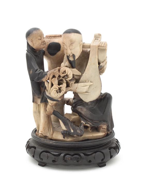 A Chinese Soapstone Carving depicting