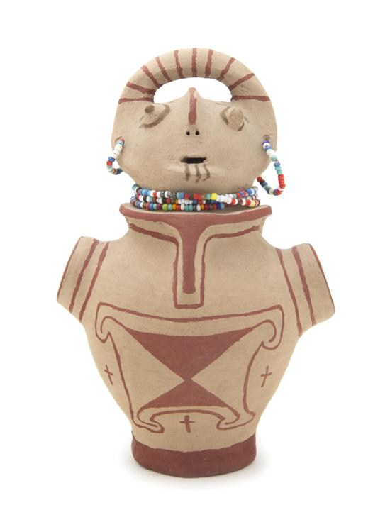 A Mojave Effigy Pot having a beaded