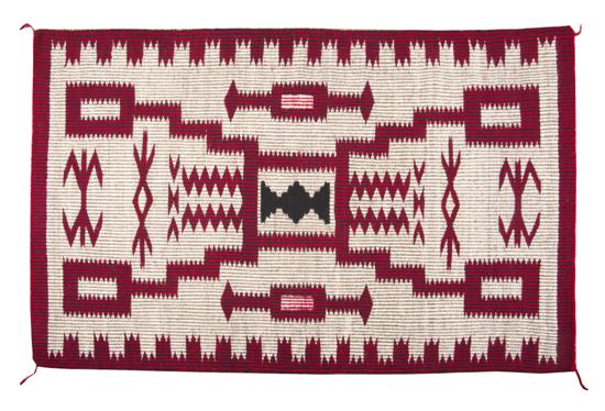 A Navajo Weaving in red black and 153c4b