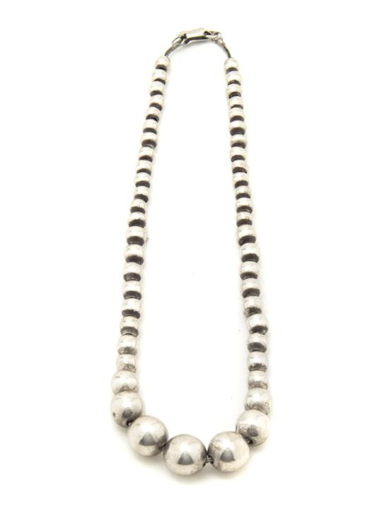A Mexican Graduated Silver Bead Necklace.