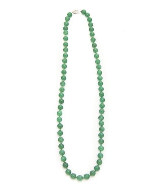 A Chinese Green Jade Bead Necklace.