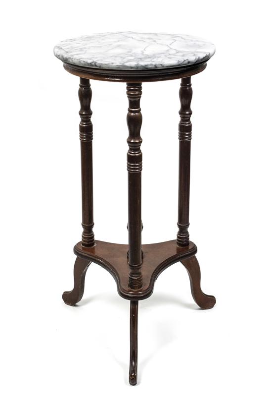 A Marble Top Side Table having a circular