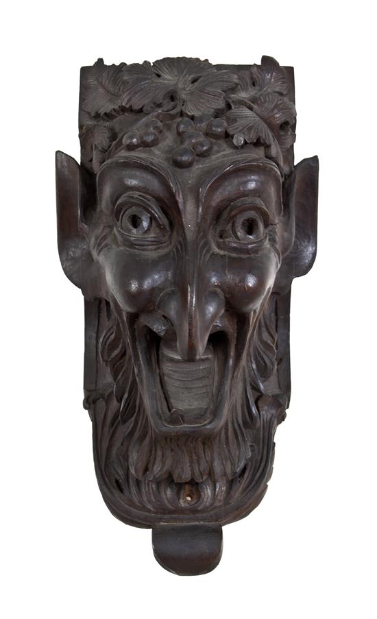 An Austrian Carved Wood Mask Fragment