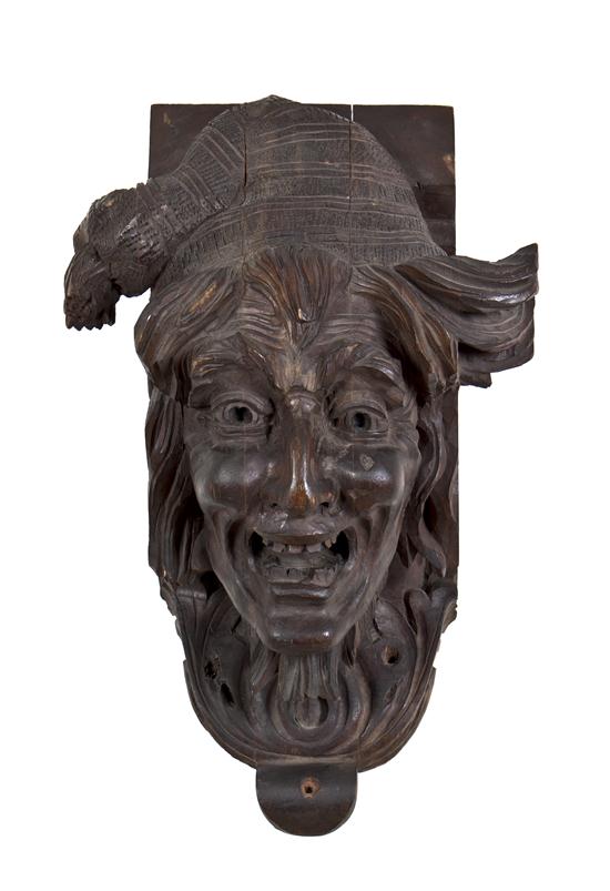 An Austrian Carved Wood Mask Fragment