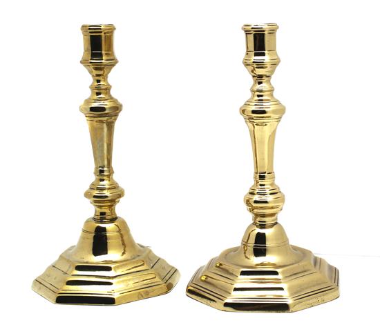 A Pair of Brass Candlesticks each raised